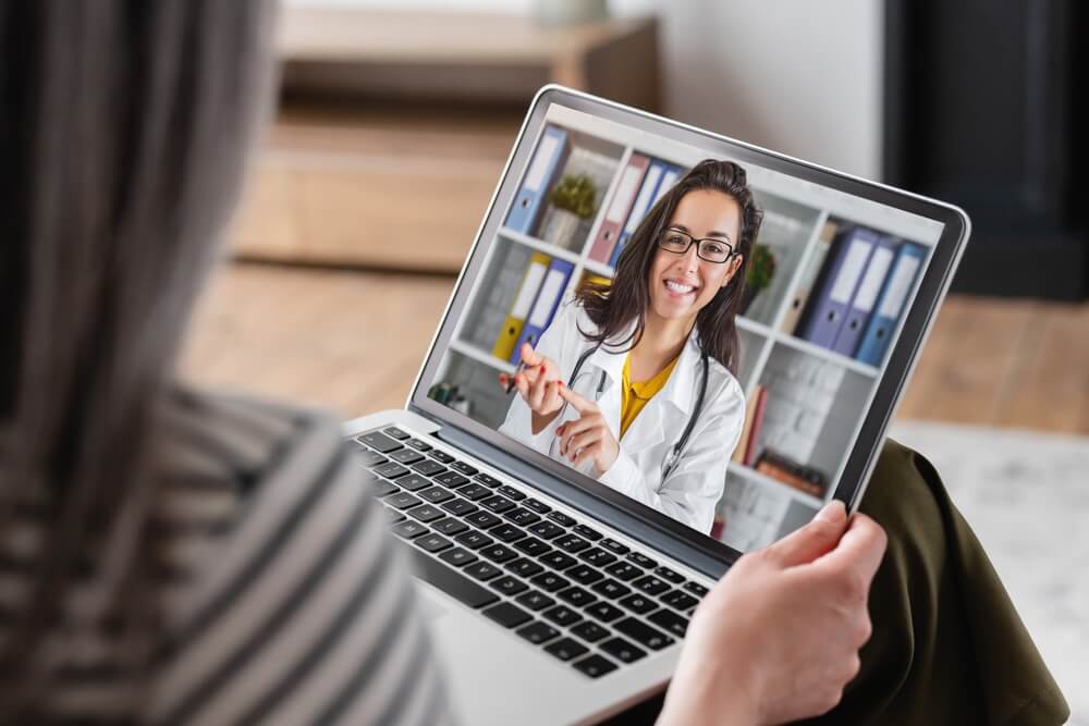 women having online telepsychiatry appointment with therapist